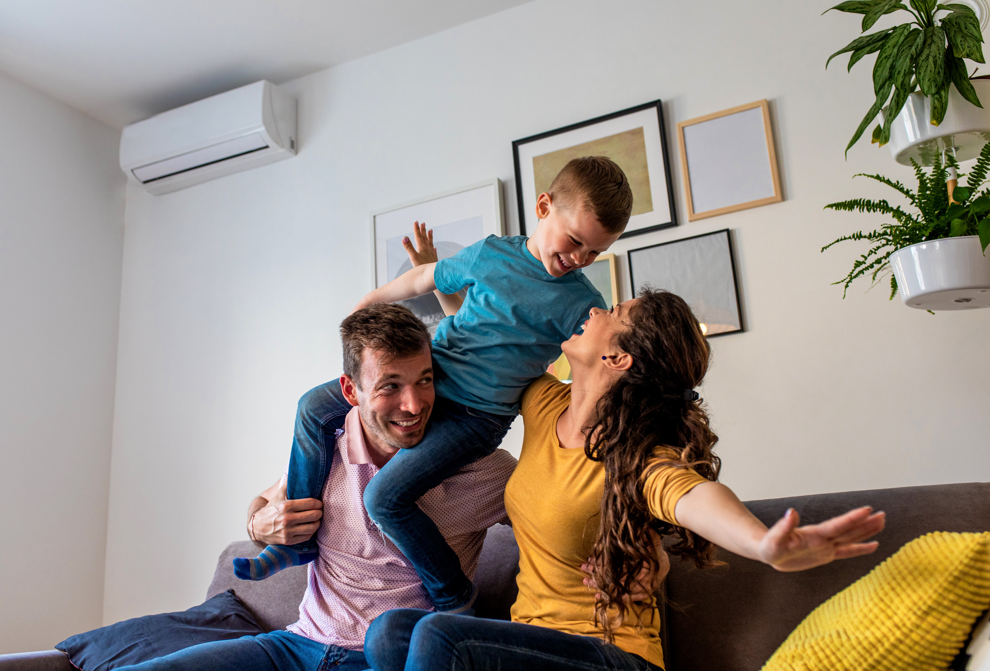 Happy family enjoying comfortable home temperature