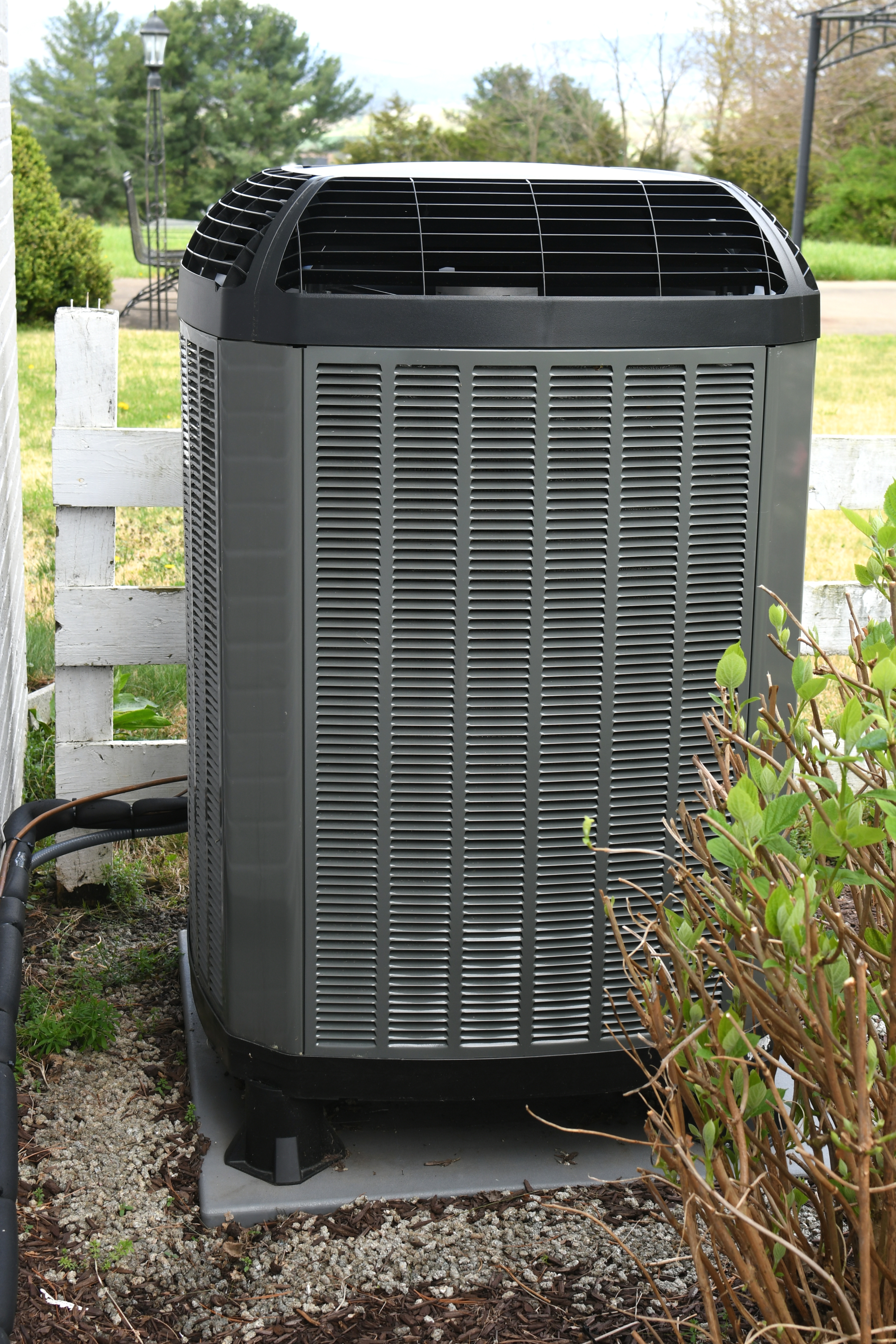 Clean high-efficiency outdoor AC unit in residential yard